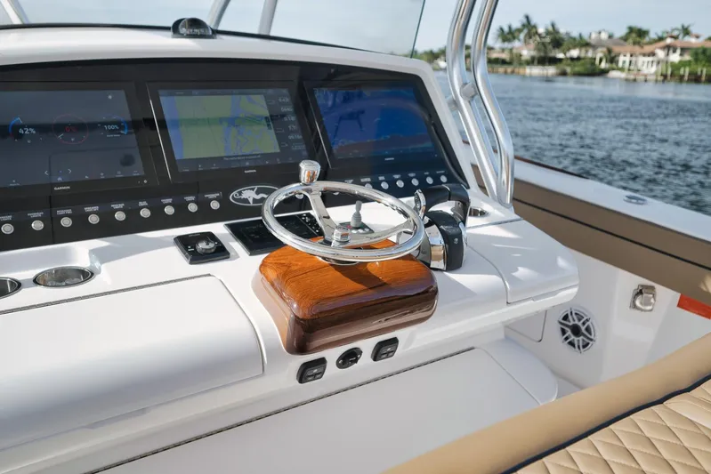  Yacht Photos Pics 2022 Valhalla Boatworks V-41 helm with advanced navigation displays and elegant steering wheel.