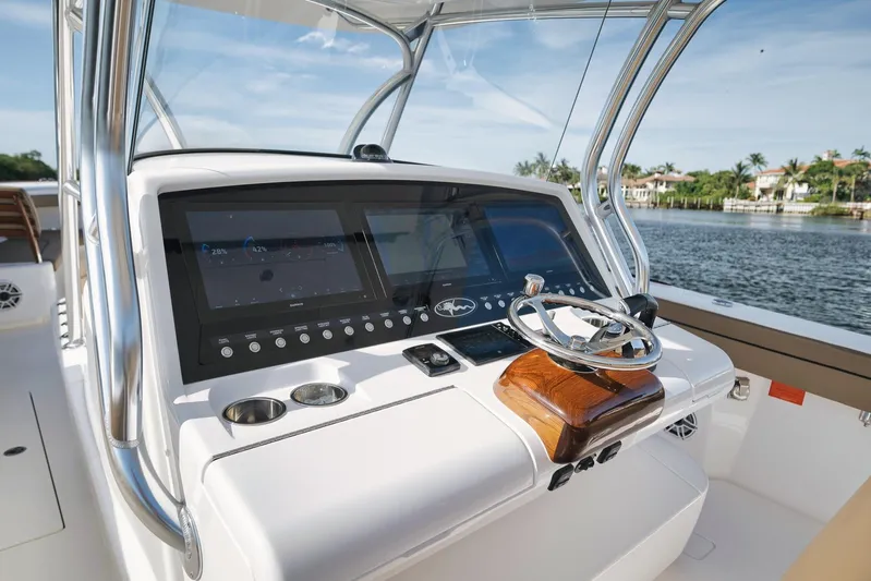  Yacht Photos Pics 2022 Valhalla Boatworks V-41 helm with modern controls and scenic water view.