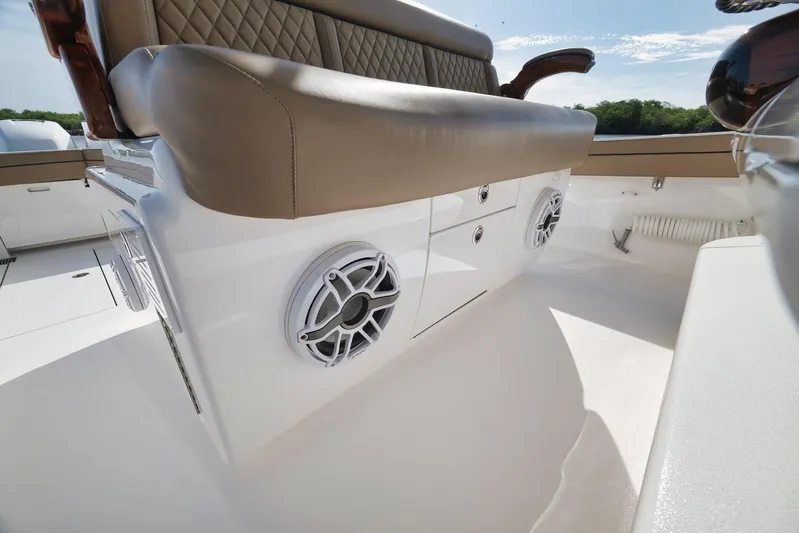  Yacht Photos Pics 2022 Valhalla Boatworks V-41 interior with cushioned seating and built-in speakers.