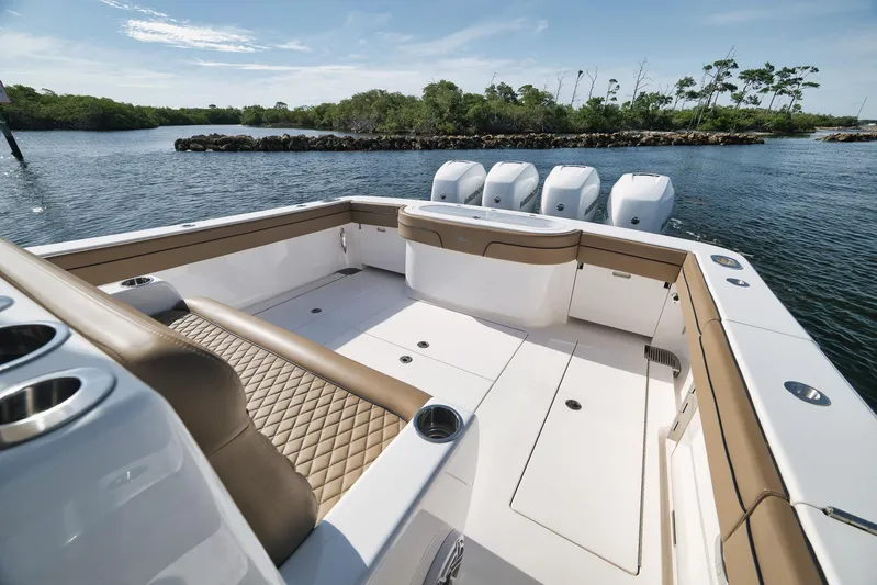  Yacht Photos Pics 2022 Valhalla Boatworks V-41, spacious deck, luxurious seating, scenic water backdrop.