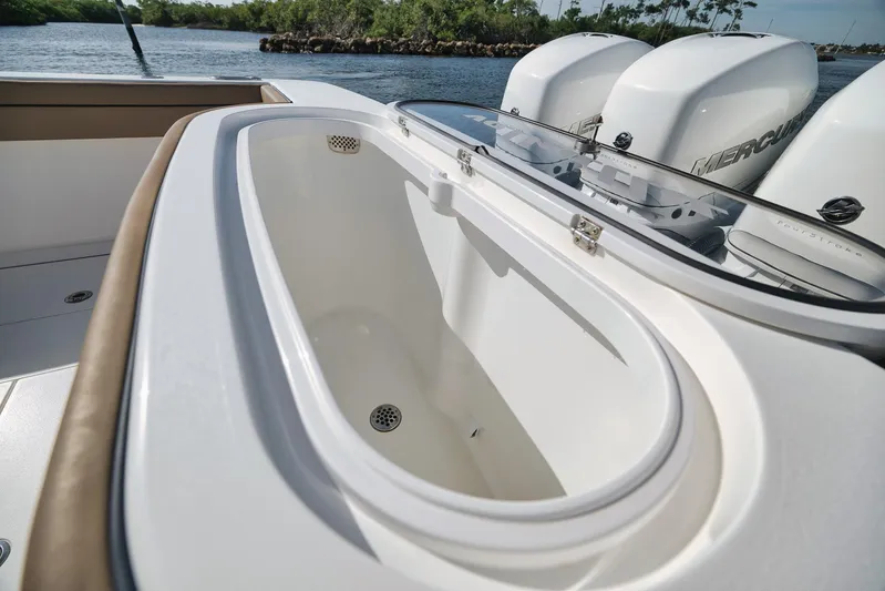  Yacht Photos Pics 2022 Valhalla Boatworks V-41 livewell with Mercury outboard engines in background.