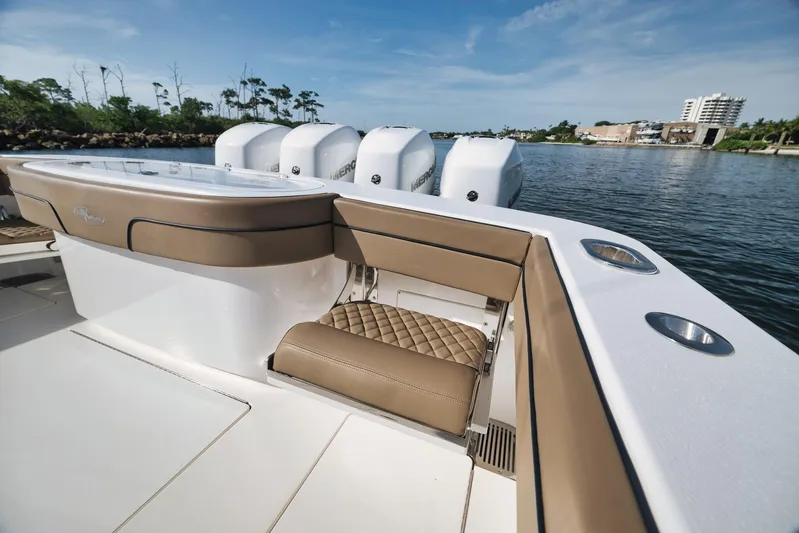  Yacht Photos Pics 2022 Valhalla Boatworks V-41 with luxurious seating and powerful engines on a serene waterway.