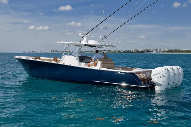  Yacht Photos Pics 2022 Valhalla Boatworks V-41 cruising on clear blue water, featuring powerful outboard engines.