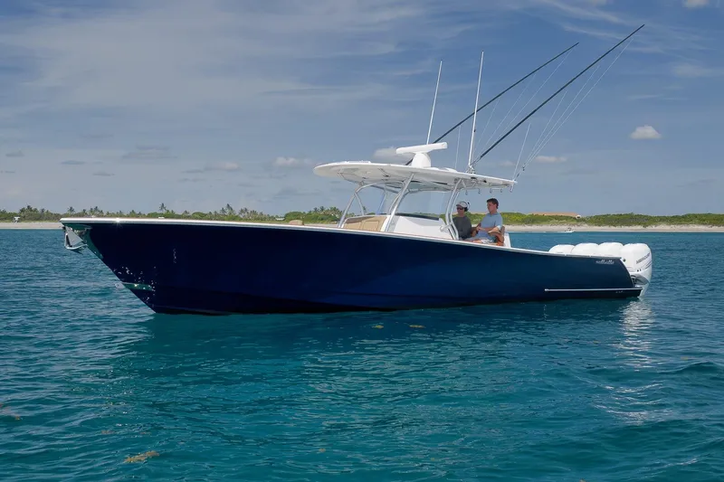  Yacht Photos Pics 2022 Valhalla Boatworks V-41 in blue, cruising on clear ocean waters.