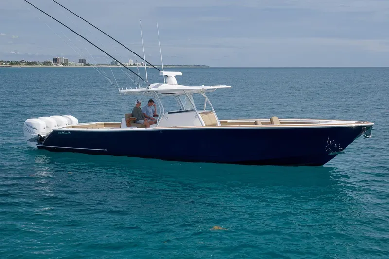  Yacht Photos Pics 2022 Valhalla Boatworks V-41 cruising on open water, featuring sleek design and powerful engines.