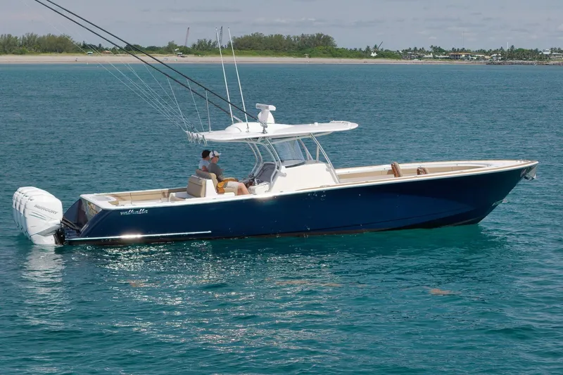  Yacht Photos Pics 2022 Valhalla Boatworks V-41 in blue, cruising on clear ocean waters.