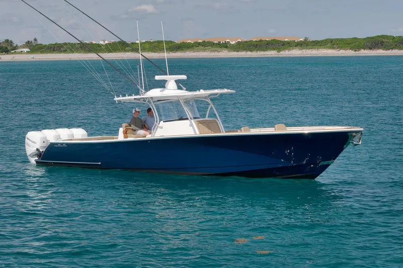  Yacht Photos Pics 2022 Valhalla Boatworks V-41 in blue, cruising on clear ocean waters.