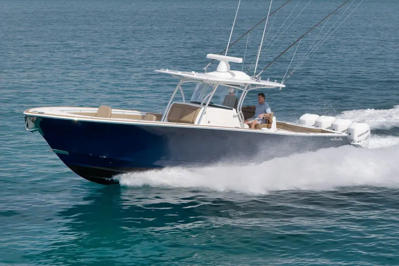  Yacht Photos Pics 2022 Valhalla Boatworks V-41 cruising on clear blue water, showcasing sleek design and powerful engines.