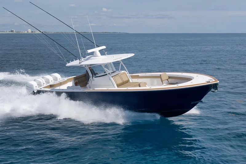  Yacht Photos Pics 2022 Valhalla Boatworks V-41 cruising on open water, showcasing sleek design and powerful engines.