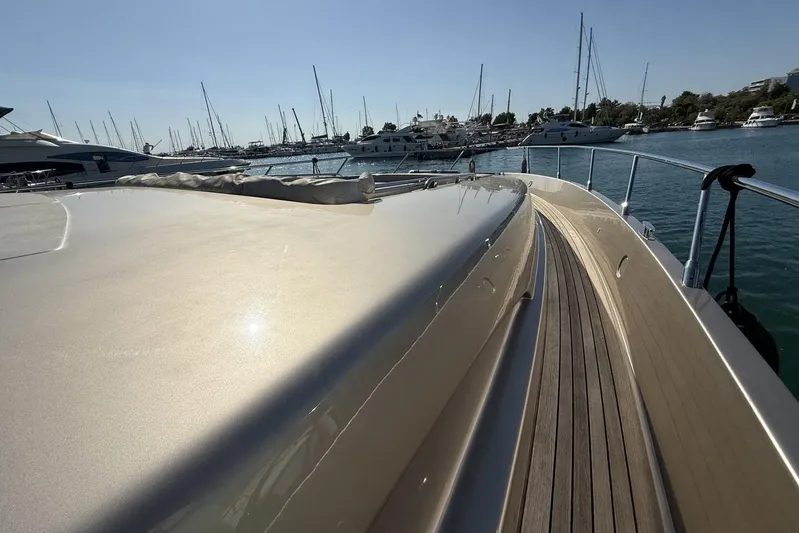 "alin 4ever" Yacht Photos Pics Luxurious 2010 Riva 68 Ego Super yacht docked in a serene marina setting.