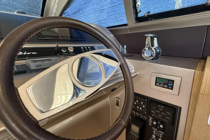 "alin 4ever" Yacht Photos Pics Steering wheel and dashboard of 2010 Riva 68 Ego Super yacht cockpit.