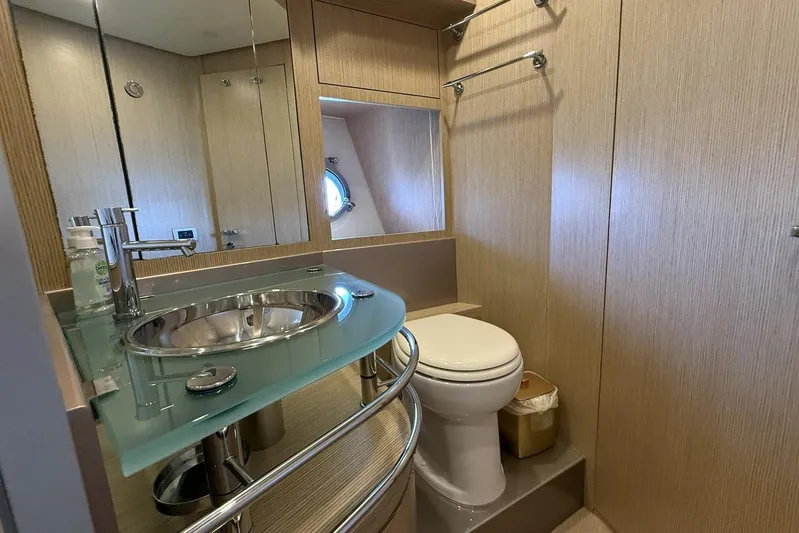 "alin 4ever" Yacht Photos Pics Luxurious bathroom in 2010 Riva 68 Ego Super yacht with modern fixtures and porthole window.