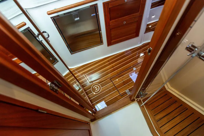 Cavu 4 Yacht Photos Pics Interior view of 2022 Hinckley Sport Boat 40 X with polished wood flooring.
