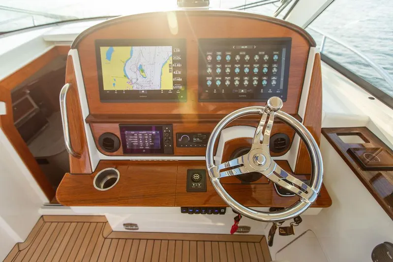 Cavu 4 Yacht Photos Pics Helm of 2022 Hinckley Sport Boat 40 X with navigation screens and steering wheel.