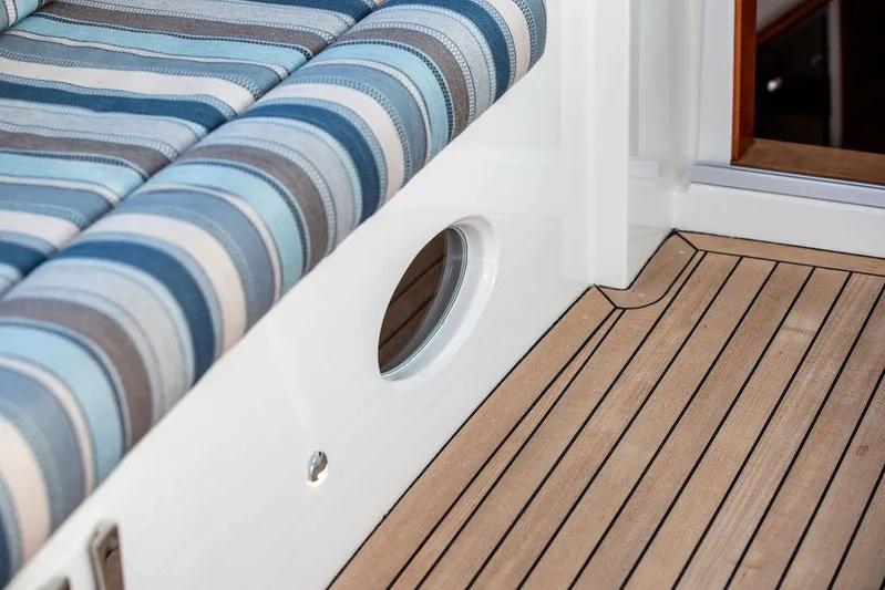 Cavu 4 Yacht Photos Pics Striped seating and teak deck on 2022 Hinckley Sport Boat 40 X.