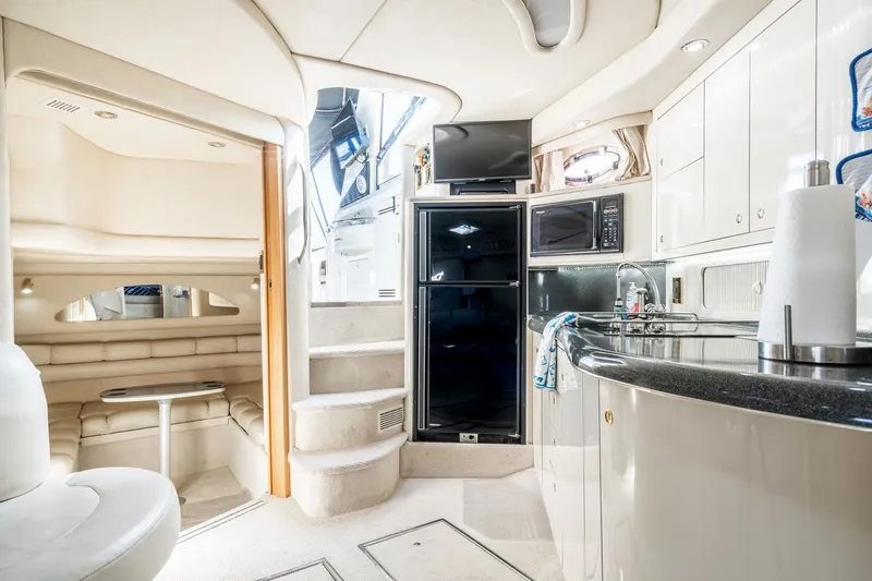  Yacht Photos Pics Luxurious interior of a 1997 Sea Ray 400 Sundancer yacht with modern amenities.