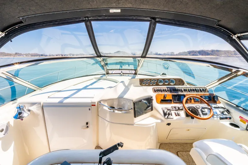  Yacht Photos Pics 1997 Sea Ray 400 Sundancer helm with panoramic water view and modern controls.