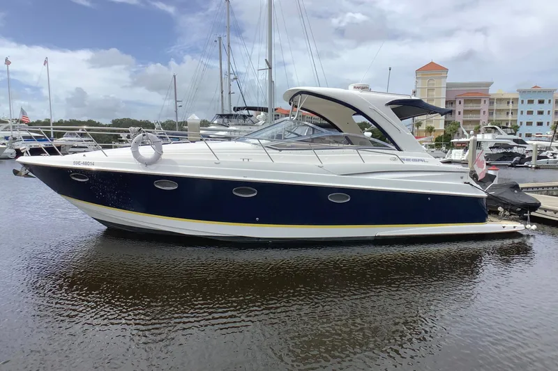 Perseides Yacht Photos Pics 2005 Regal Commodore 3860 yacht docked in a marina, featuring sleek design and modern amenities.