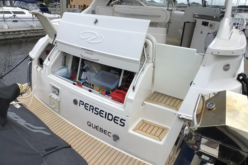 Perseides Yacht Photos Pics 2005 Regal Commodore 3860 yacht docked, open storage compartment, labeled "PERSEIDES" from Québec.