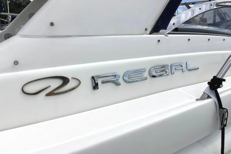 Perseides Yacht Photos Pics 2005 Regal Commodore 3860 boat with logo on white hull.