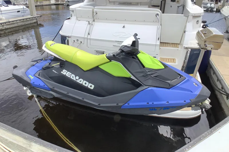 Perseides Yacht Photos Pics Blue and green Sea-Doo jet ski docked beside a 2005 Regal Commodore 3860 yacht.