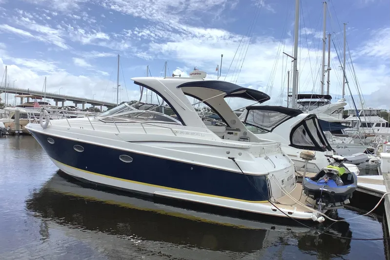 Perseides Yacht Photos Pics 2005 Regal Commodore 3860 yacht docked at marina under blue sky.
