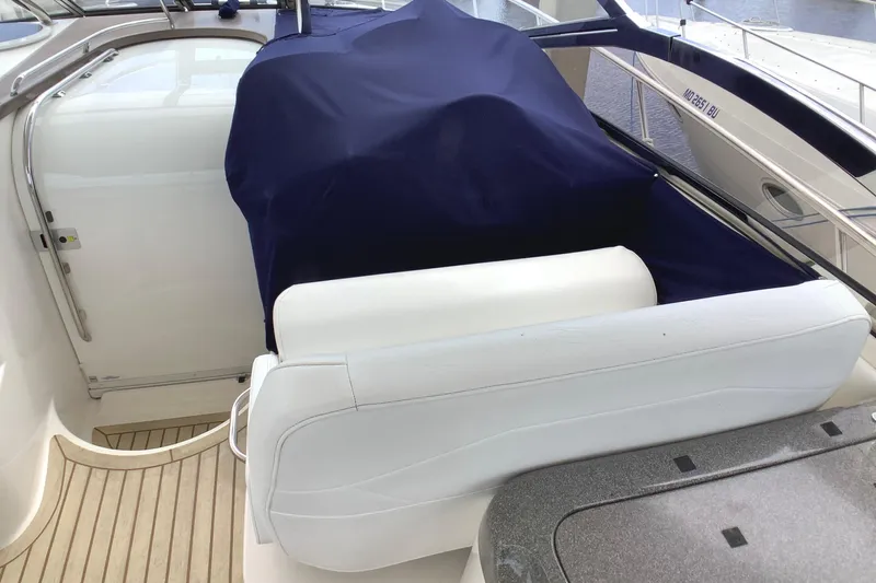 Perseides Yacht Photos Pics 2005 Regal Commodore 3860 yacht interior with covered seating and sleek design.