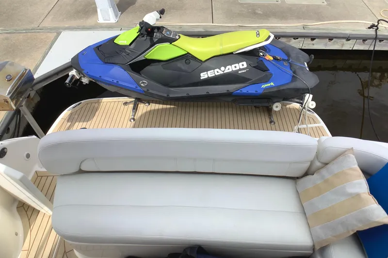 Perseides Yacht Photos Pics 2005 Regal Commodore 3860 yacht with Sea-Doo jet ski on deck, featuring white seating.