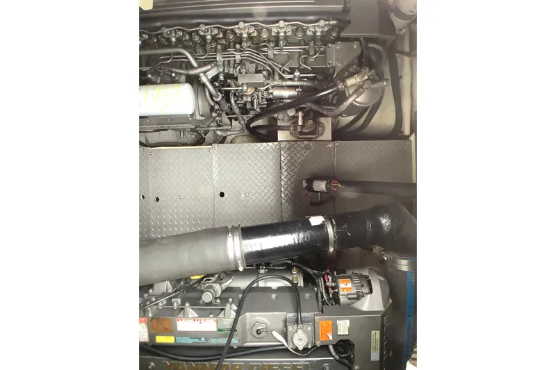 Perseides Yacht Photos Pics Engine compartment of a 2005 Regal Commodore 3860 boat, showcasing mechanical components.