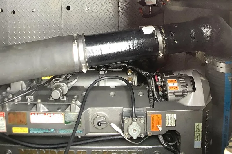 Perseides Yacht Photos Pics Engine compartment of 2005 Regal Commodore 3860 boat, featuring detailed mechanical components.