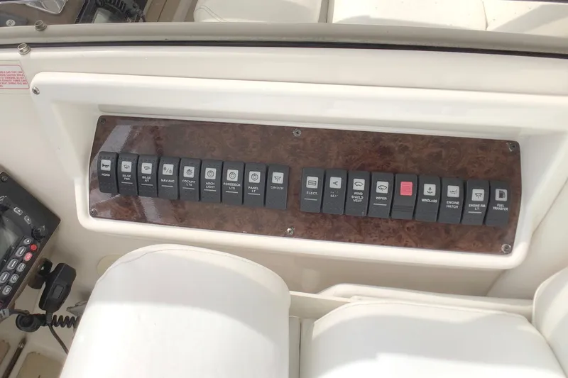 Perseides Yacht Photos Pics Control panel of a 2005 Regal Commodore 3860 boat with labeled switches.