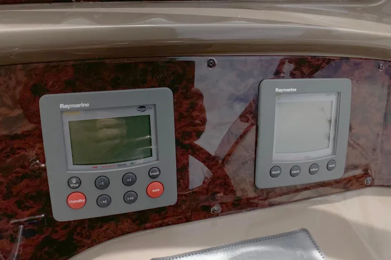 Perseides Yacht Photos Pics Raymarine navigation displays on 2005 Regal Commodore 3860 boat dashboard.