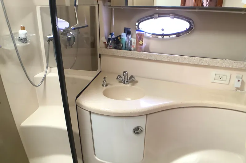 Perseides Yacht Photos Pics Bathroom interior of 2005 Regal Commodore 3860 yacht with sink and shower.