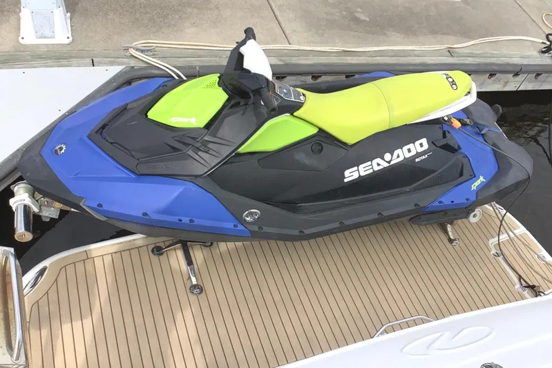 Perseides Yacht Photos Pics Blue and green Sea-Doo jet ski on a Regal Commodore 3860 boat deck.