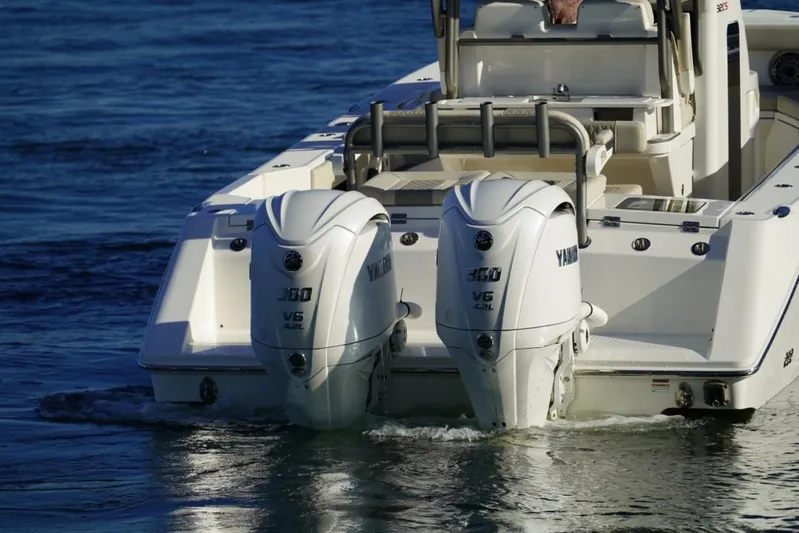  Yacht Photos Pics 2024 Solace 32 CS boat with dual Yamaha 300 V6 outboard engines on water.
