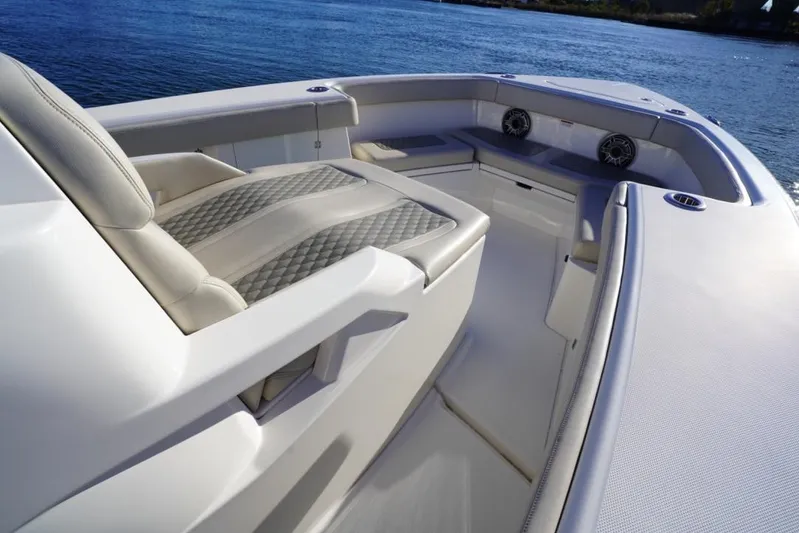  Yacht Photos Pics 2024 Solace 32 CS boat interior with luxurious seating and ocean view.