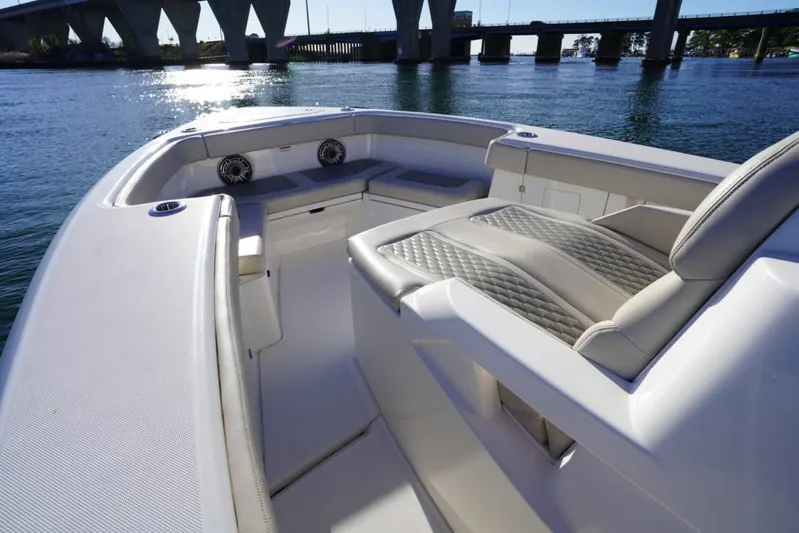  Yacht Photos Pics 2024 Solace 32 CS boat interior with luxurious seating and scenic water view.