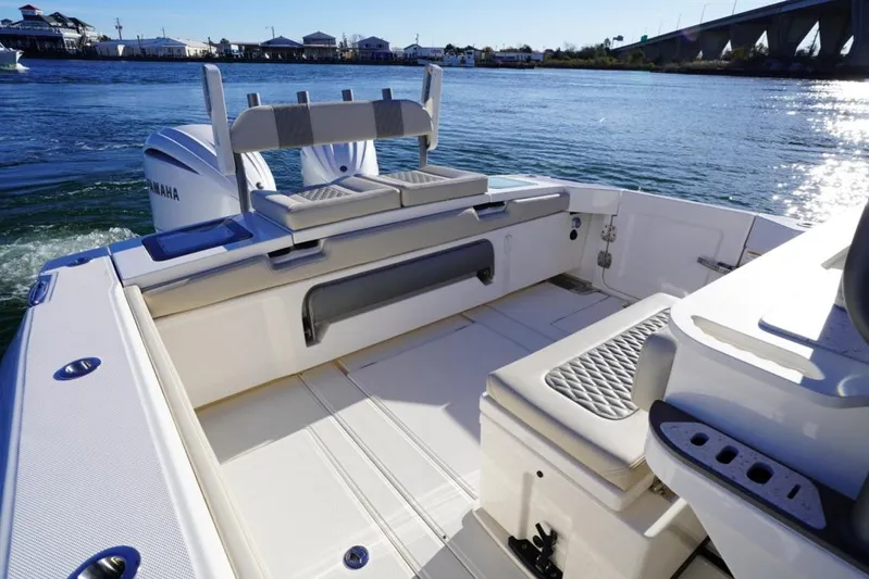  Yacht Photos Pics 2024 Solace 32 CS boat interior with Yamaha engines, on a sunny day by the water.