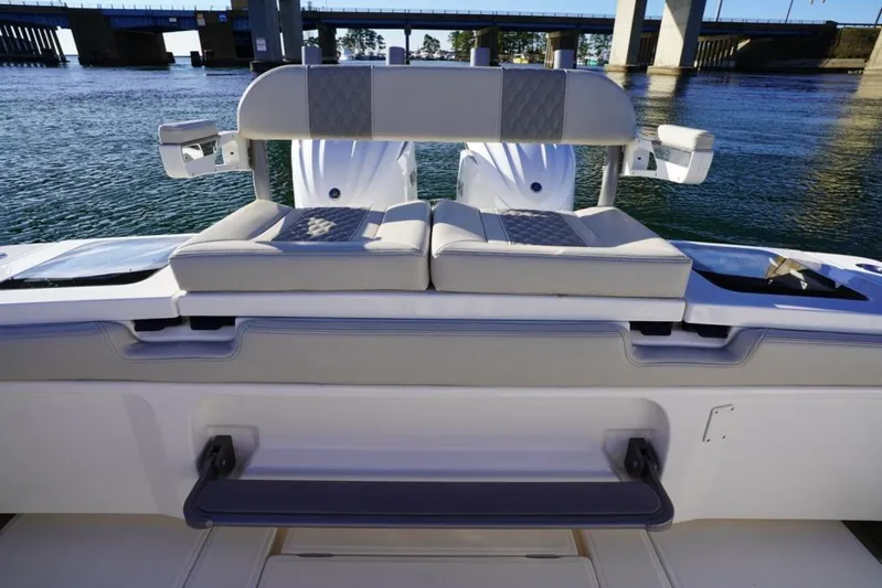  Yacht Photos Pics 2024 Solace 32 CS boat interior with cushioned seating and water view.