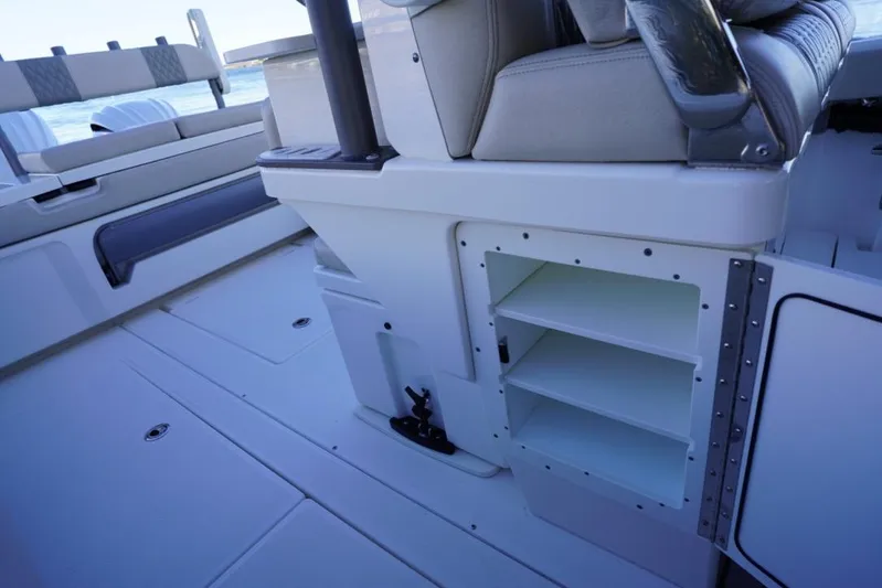  Yacht Photos Pics 2024 Solace 32 CS boat interior with seating and storage compartments.