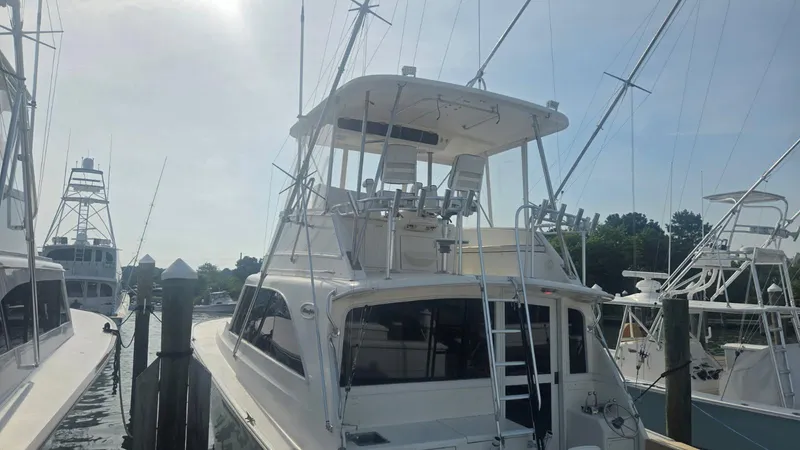 In 2 Deep Yacht Photos Pics 1984 Ocean Yachts 46 Super Sport docked, showcasing its flybridge and sleek design.