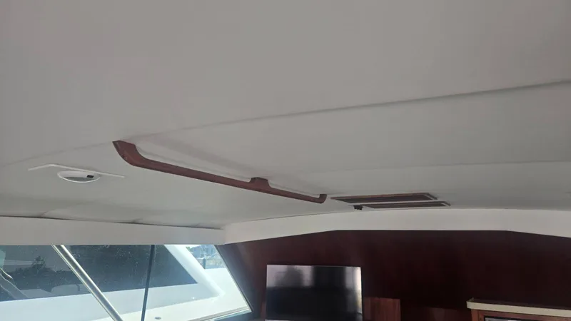 In 2 Deep Yacht Photos Pics Interior view of 1984 Ocean Yachts 46 Super Sport, featuring ceiling and window details.