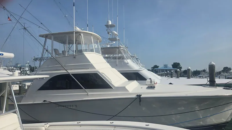 In 2 Deep Yacht Photos Pics 1984 Ocean Yachts 46 Super Sport docked at marina under clear blue sky.