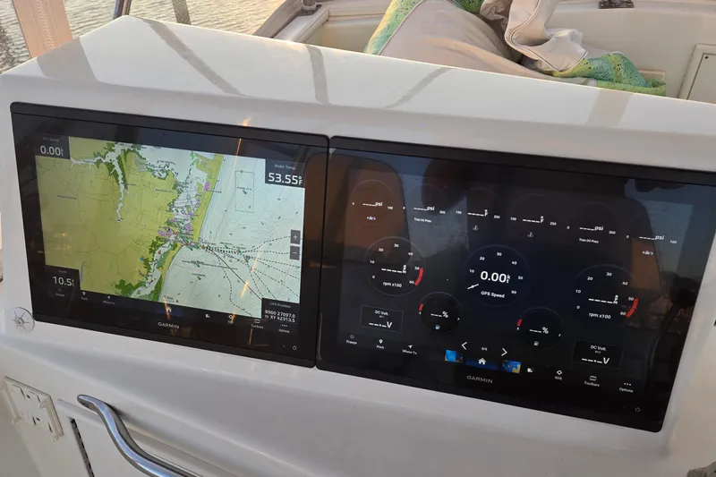 In 2 Deep Yacht Photos Pics Dual Garmin displays on 1984 Ocean Yachts 46 Super Sport, showing navigation and engine data.