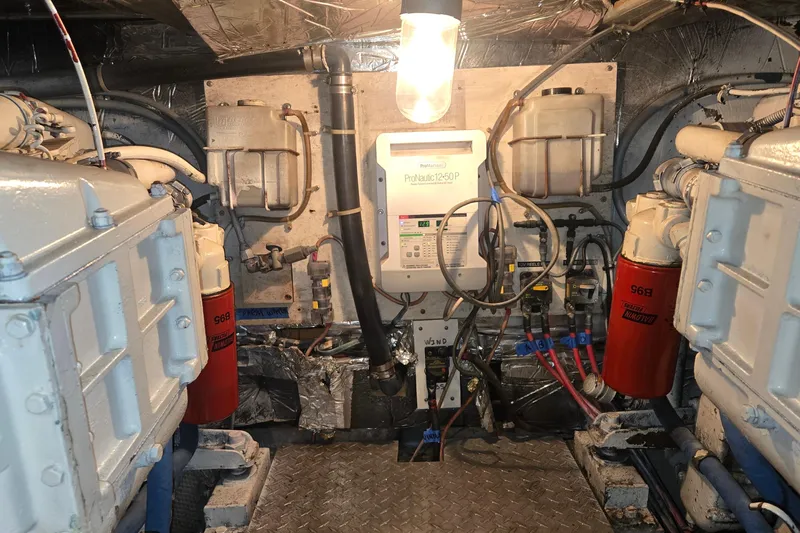 In 2 Deep Yacht Photos Pics Engine room of 1984 Ocean Yachts 46 Super Sport with mechanical components and wiring.