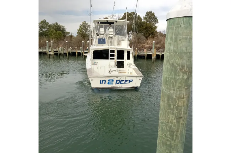 In 2 Deep Yacht Photos Pics 1984 Ocean Yachts 46 Super Sport boat named "In 2 Deep" docked in a marina.