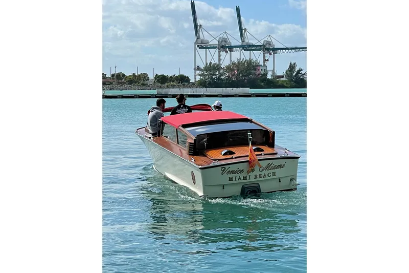 Venice In Miami Yacht Photos Pics 2002 A&M Manufacturing Veneziano Convertible boat cruising in Miami Beach waters.