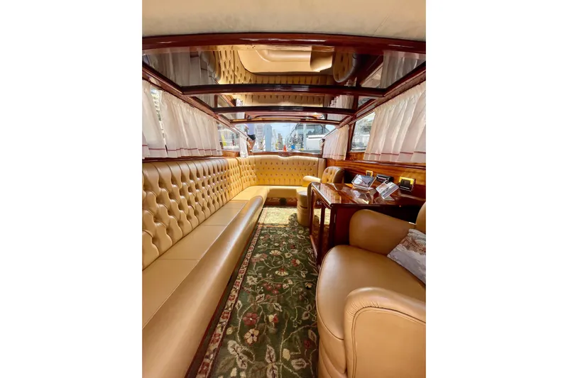 Venice In Miami Yacht Photos Pics Luxurious interior of 2002 A&M Manufacturing Veneziano Convertible with plush seating and elegant decor.