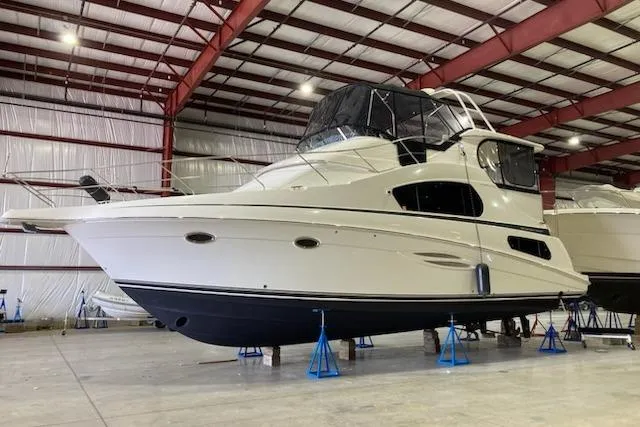Go Jump In The Lake Yacht Photos Pics 2003 Silverton 39 Motor Yacht in indoor storage on stands.