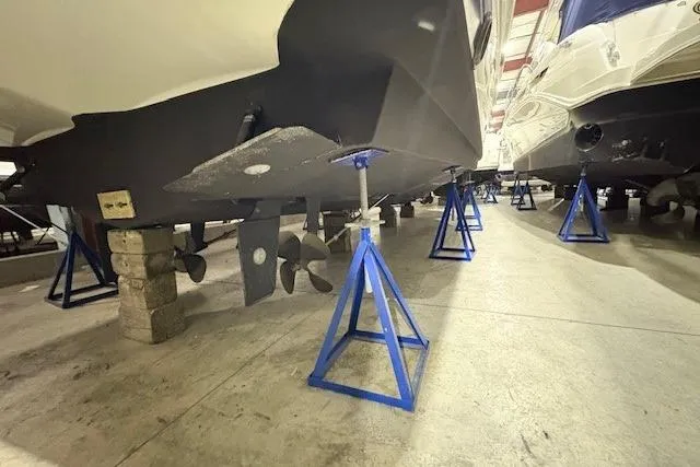 Go Jump In The Lake Yacht Photos Pics 2003 Silverton 39 Motor Yacht on stands in storage facility.